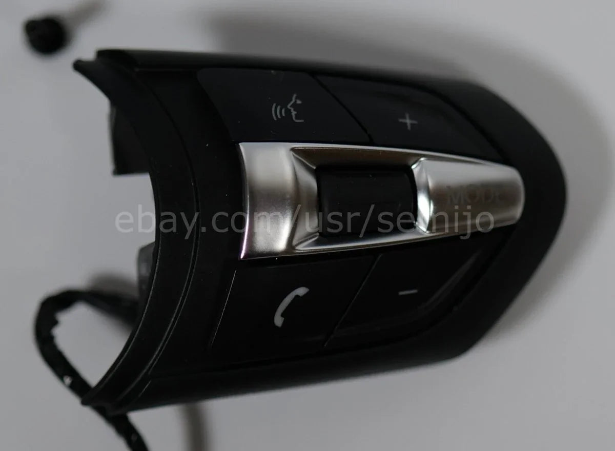 BMW F Series M Sport steering wheel button controls with phone, mode, and voice icons