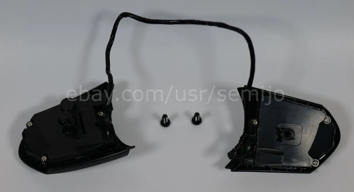 BMW F Series M Sport steering wheel button controls with wiring and screws on white background
