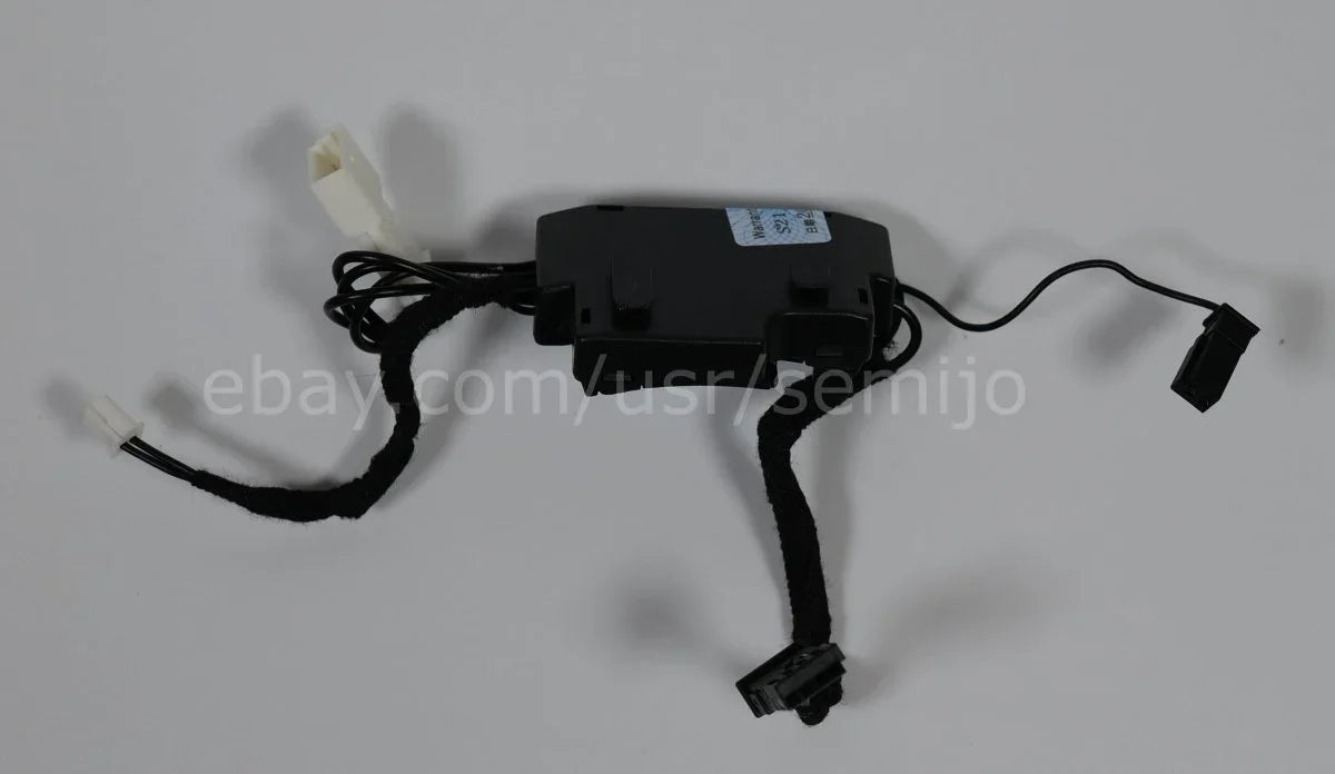 BMW F Series steering wheel control module with connectors on a plain background