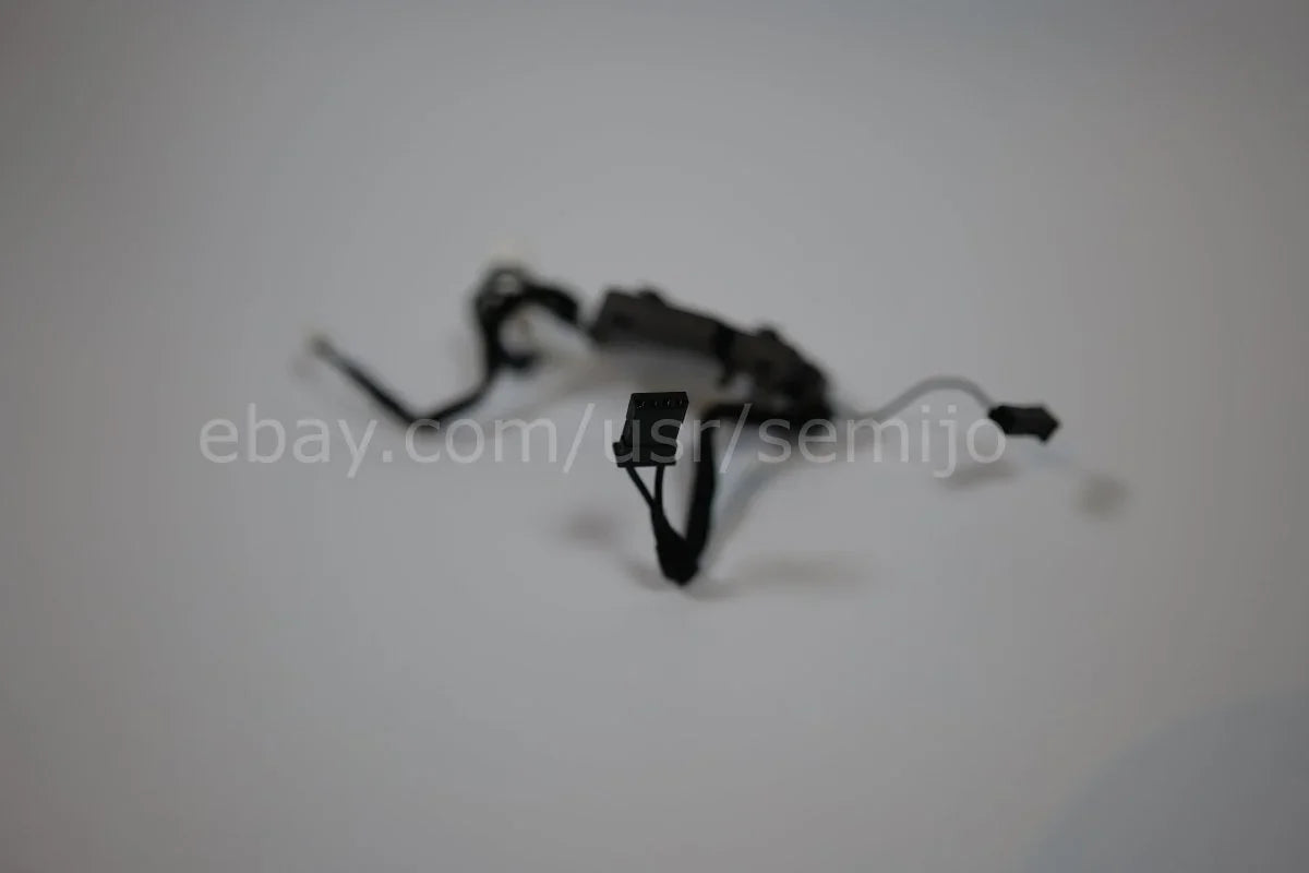 BMW F Series steering wheel control module with wires on white background