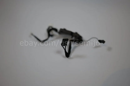 BMW F Series steering wheel control module with wires on white background