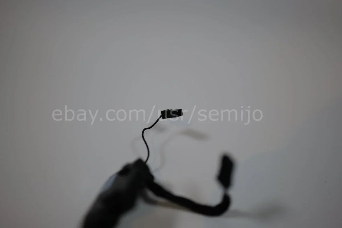 BMW F Series steering wheel control module wiring with connector on a plain background