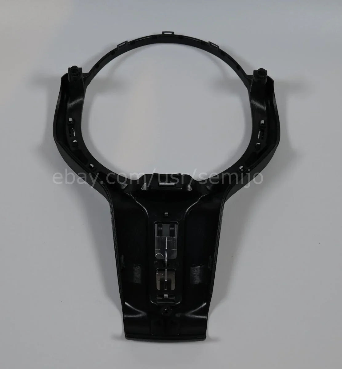 Steering wheel front cover trim for BMW F Series M Sport, black plastic, with central hole.