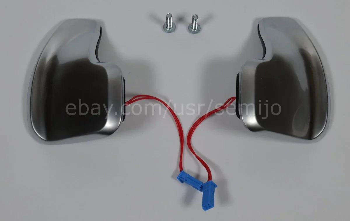 Silver BMW F Series M Sport steering wheel paddle shifters with red wires and screws