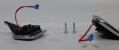 BMW F Series steering wheel paddle shifters with wiring and mounting screws on white background