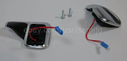 BMW F Series steering wheel paddle shifters with wiring and screws on white background