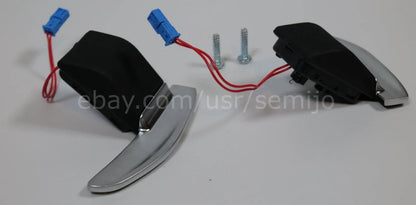Silver steering wheel paddle shifters for BMW F Series with wiring and screws on white background