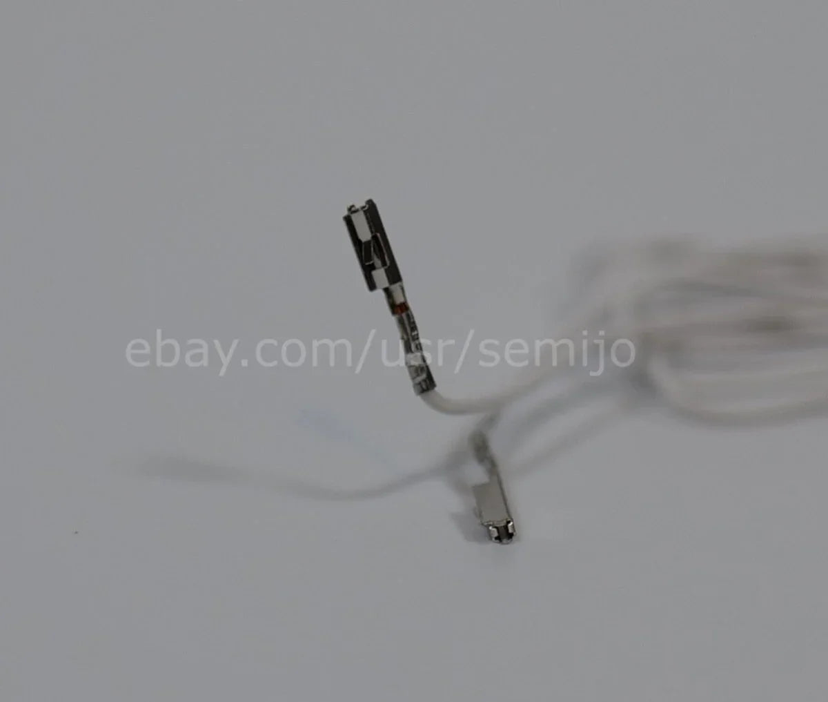 BMW F Series steering wheel paddle shifters wiring cable with connectors on white background