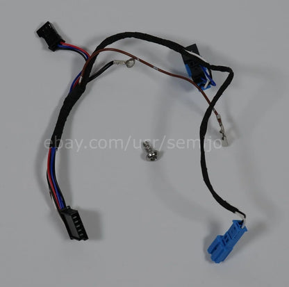 BMW F Series steering wheel wiring cable with connectors and a screw on white background
