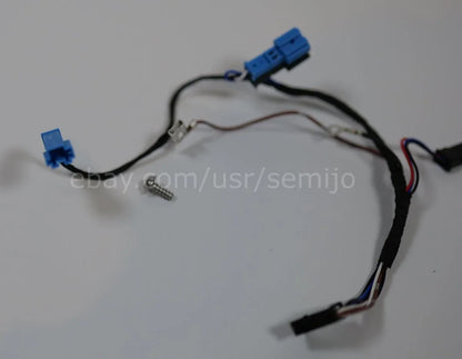 BMW F Series steering wheel wiring cable with blue connectors and screw on white background