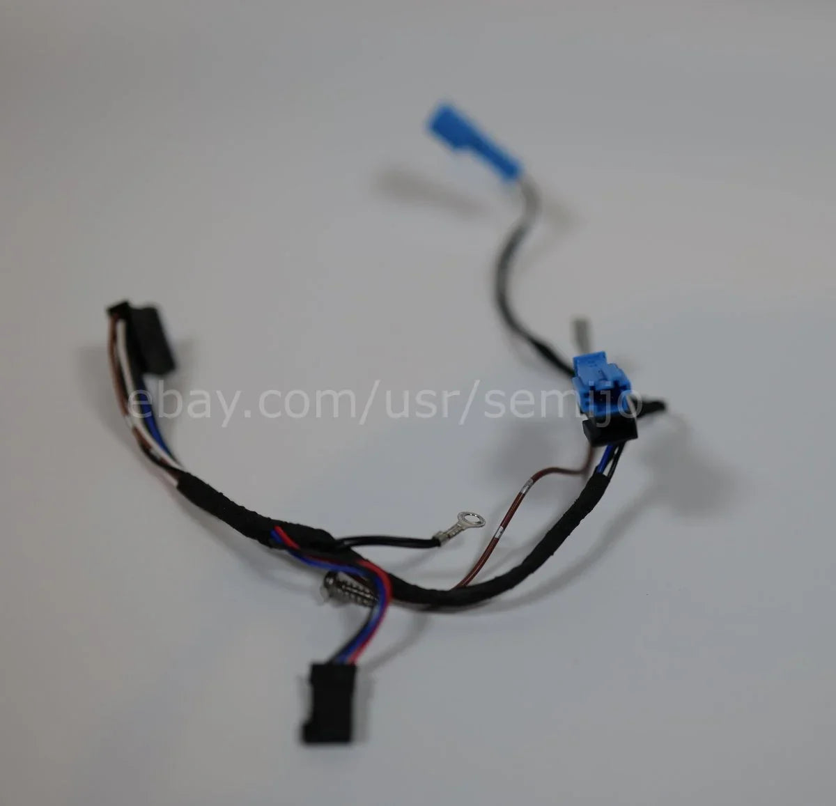 BMW F Series steering wheel wiring harness with cable connectors on white background